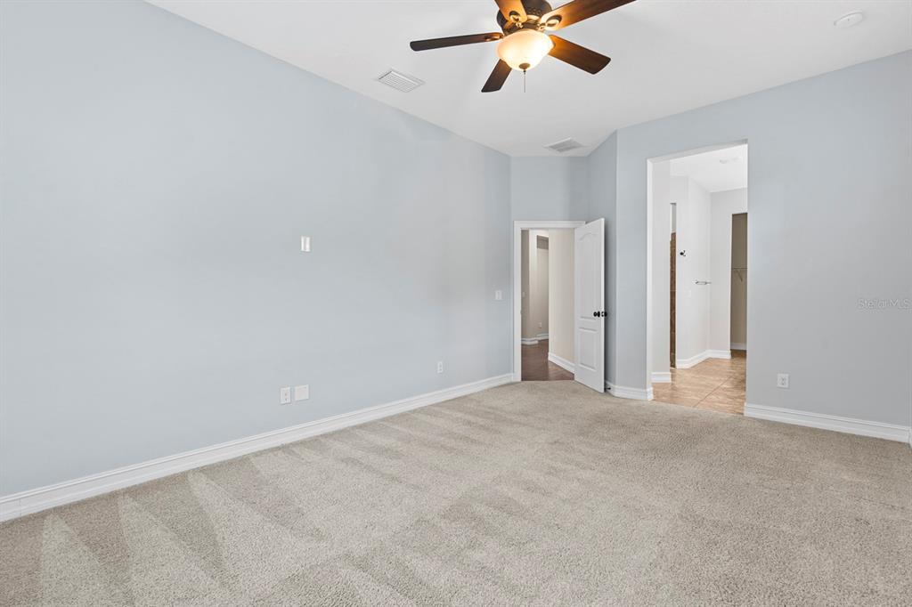 6809 Scenic Drive Apollo Beach, FL 33572 - Photo 52 of 94 a view of an empty room with a ceiling fan