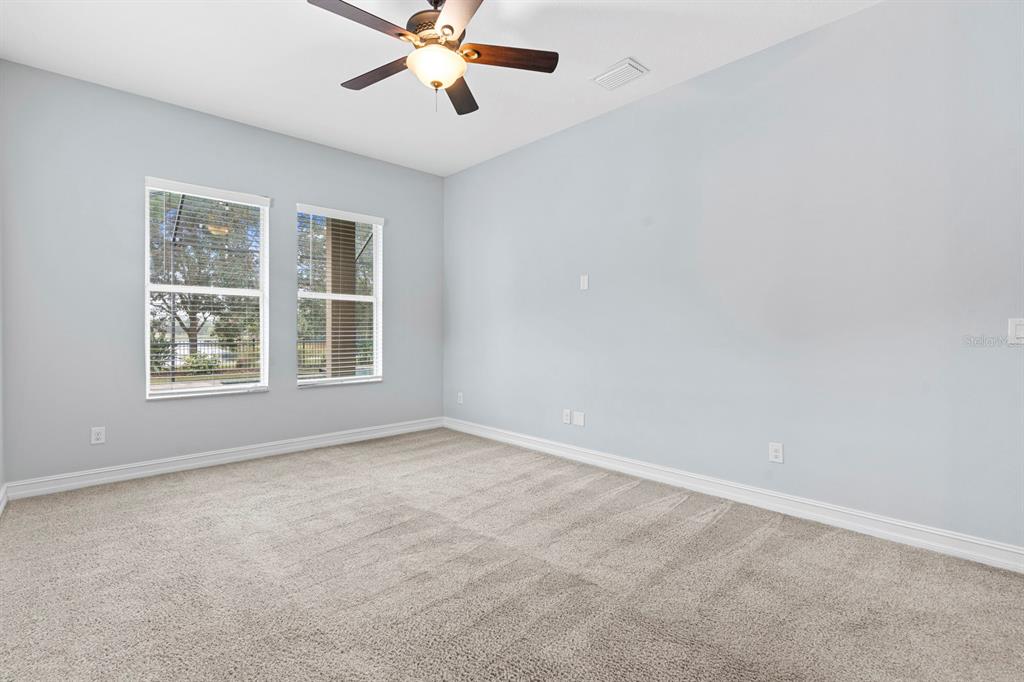 6809 Scenic Drive Apollo Beach, FL 33572 - Photo 53 of 94 an empty room with windows and fan
