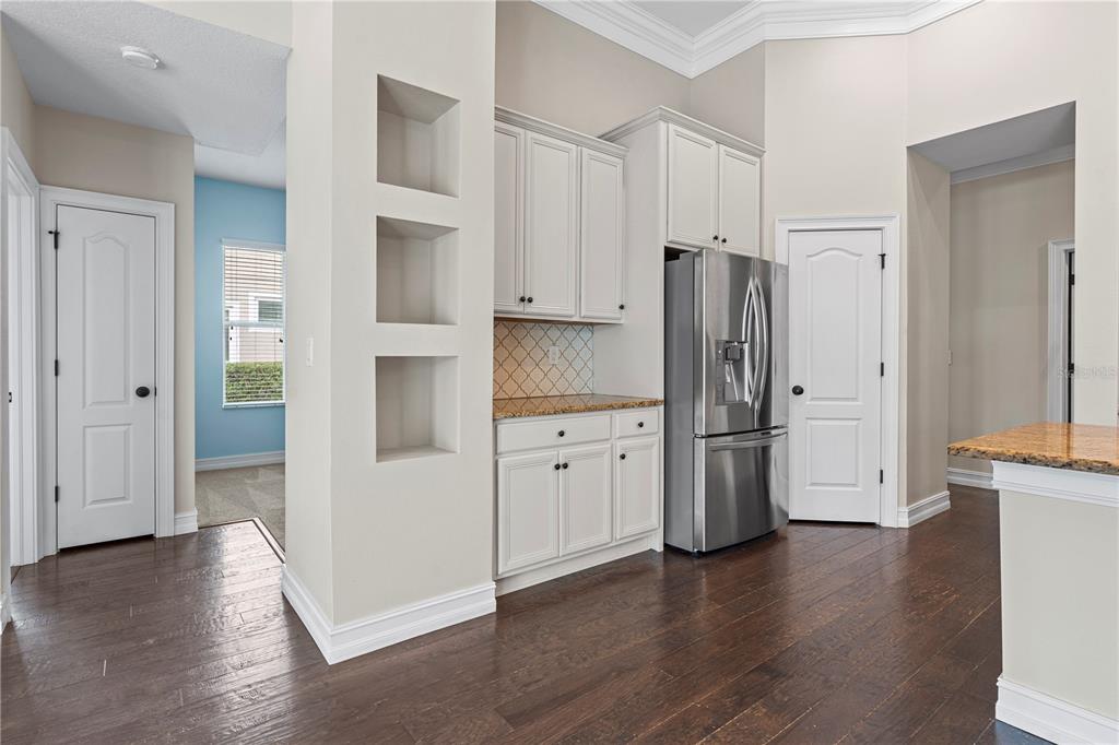 6809 Scenic Drive Apollo Beach, FL 33572 - Photo 62 of 94 a kitchen with stainless steel appliances a refrigerator and wooden cabinets
