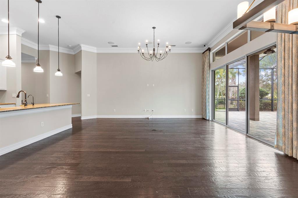 6809 Scenic Drive Apollo Beach, FL 33572 - Photo 64 of 94 a view of an empty room with wooden floor and a window