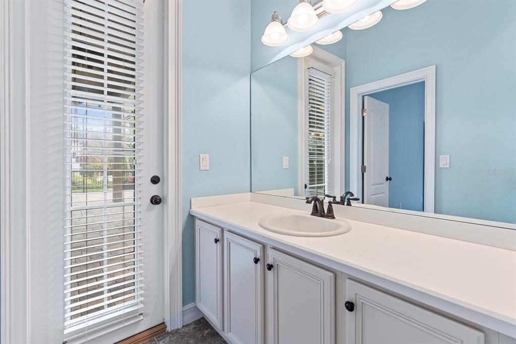 6809 Scenic Drive Apollo Beach, FL 33572 - Photo 76 of 94 a bathroom with a sink vanity and a mirror