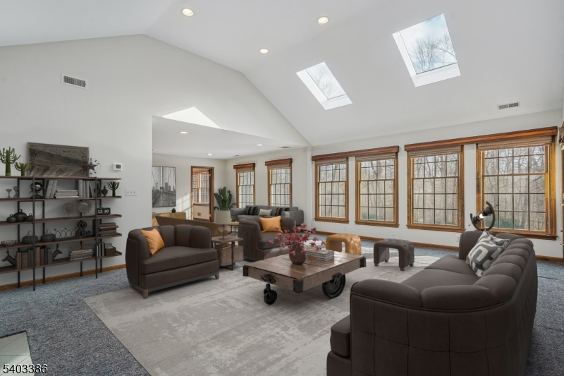 80 Spring Valley Road Morristown, NJ 07960 - Photo 13 of 48 a living room with furniture and large windows