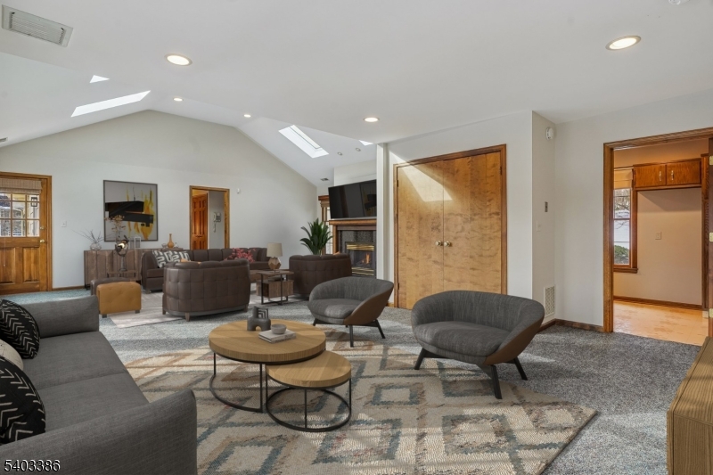 80 Spring Valley Road Morristown, NJ 07960 - Photo 15 of 48 a living room with furniture couches and a flat screen tv