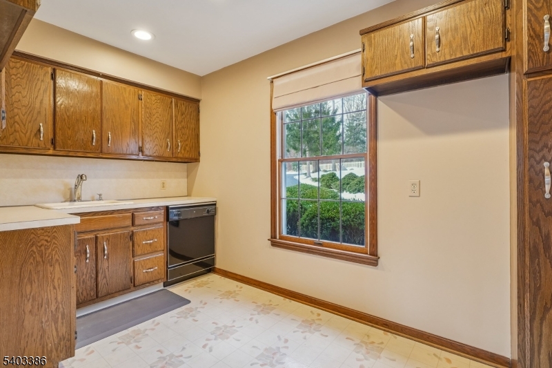 80 Spring Valley Road Morristown, NJ 07960 - Photo 16 of 48 a kitchen with stainless steel appliances granite countertop cabinets and window