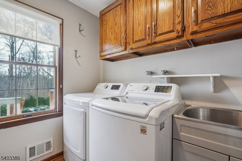 80 Spring Valley Road Morristown, NJ 07960 - Photo 19 of 48 a utility room with dryer and washer