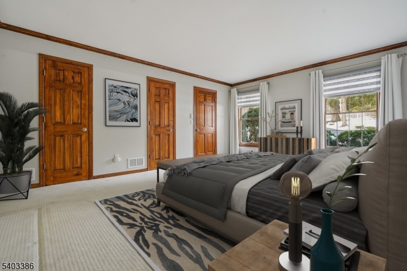 80 Spring Valley Road Morristown, NJ 07960 - Photo 20 of 48 a bed sitting in a bedroom next to a window