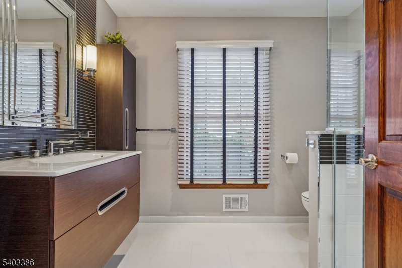 80 Spring Valley Road Morristown, NJ 07960 - Photo 23 of 48 a bathroom with a bathtub and a sink