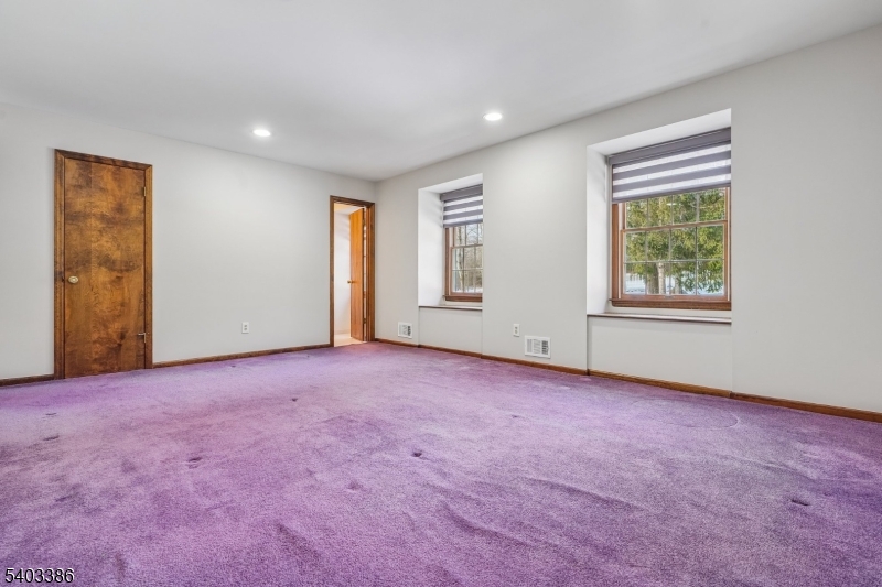 80 Spring Valley Road Morristown, NJ 07960 - Photo 25 of 48 an empty room with windows and closet