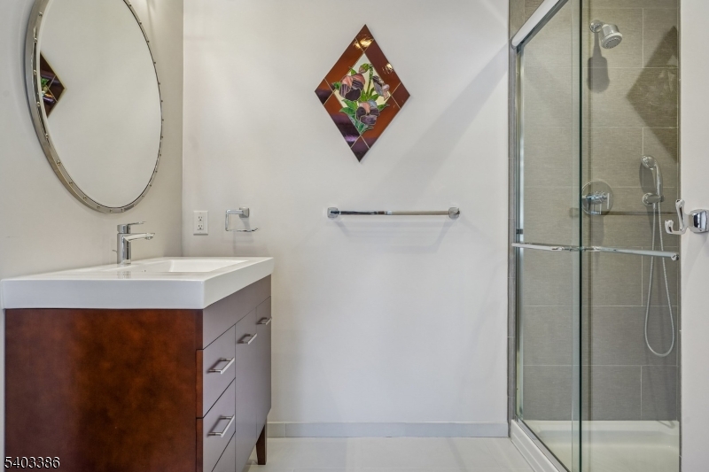 80 Spring Valley Road Morristown, NJ 07960 - Photo 26 of 48 a bathroom with a sink and a mirror