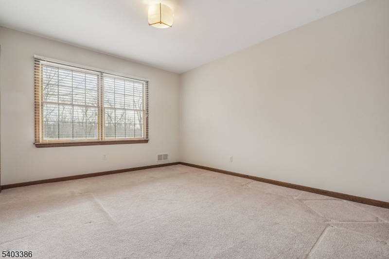 80 Spring Valley Road Morristown, NJ 07960 - Photo 27 of 48 an empty room with windows