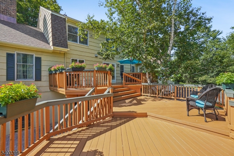 80 Spring Valley Road Morristown, NJ 07960 - Photo 37 of 48 a view of a house with wooden deck and furniture