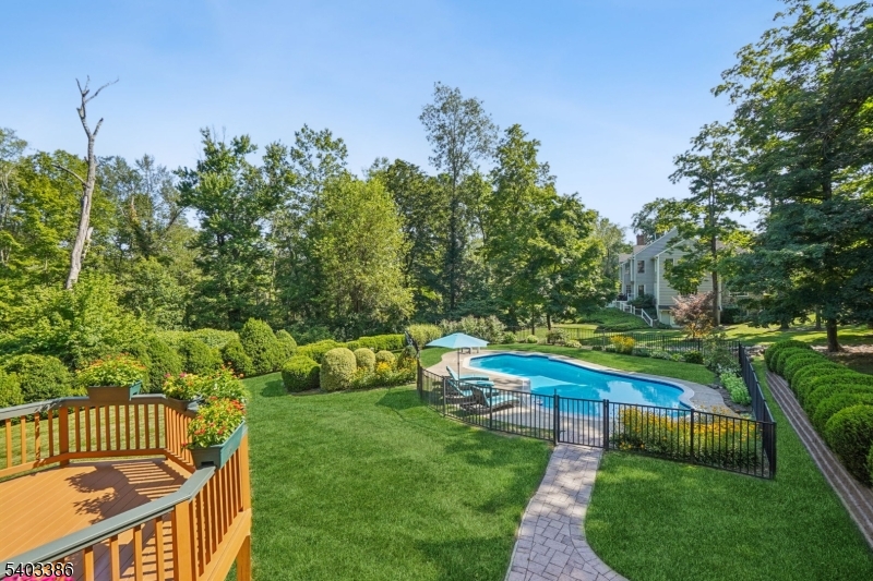 80 Spring Valley Road Morristown, NJ 07960 - Photo 39 of 48 a view of a garden with swimming pool