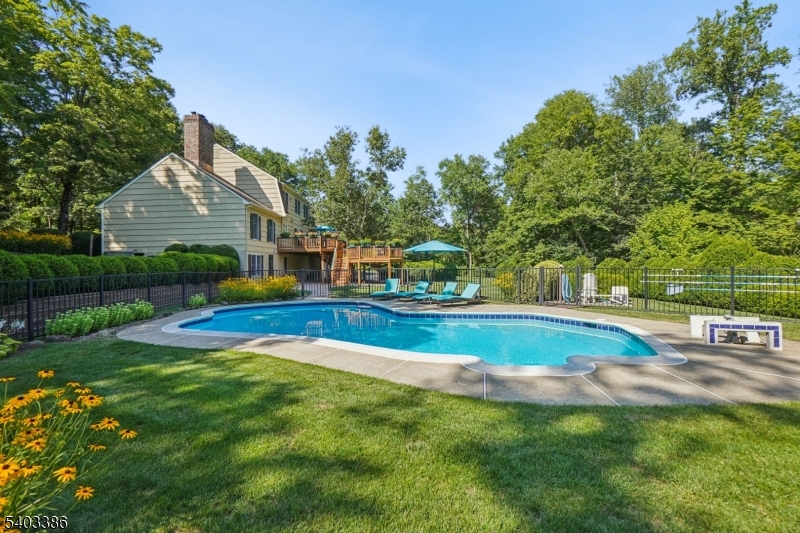 80 Spring Valley Road Morristown, NJ 07960 - Photo 40 of 48 a view of pool with lawn chairs and plants