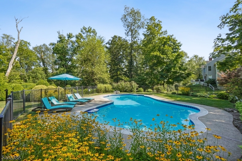 80 Spring Valley Road Morristown, NJ 07960 - Photo 43 of 48 a view of a swimming pool with a yard