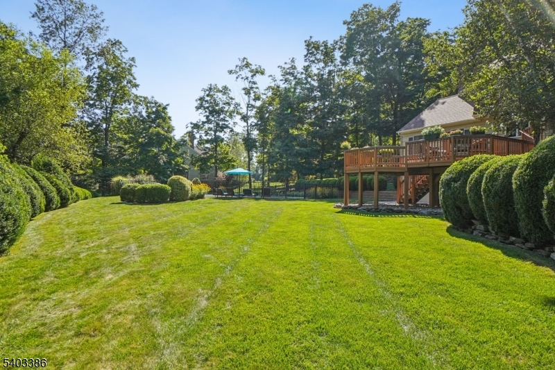 80 Spring Valley Road Morristown, NJ 07960 - Photo 44 of 48 a view of a house with a backyard and a patio
