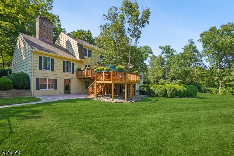 80 Spring Valley Road Morristown, NJ 07960 - Photo 45 of 48 a view of a house with a yard deck and sitting area
