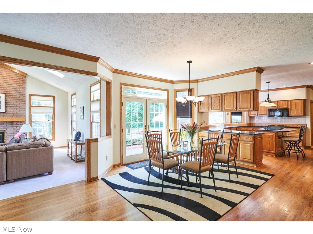 2460 Shadow Ridge Lane Fairlawn, OH 44333 - Photo 5 of 29 large eating area laos with oak wood floors and glass French doors leads to deck!