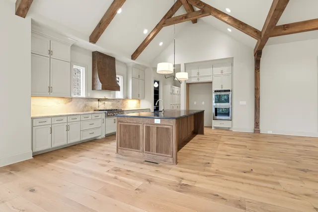 a view of a kitchen with a fireplace and a window
