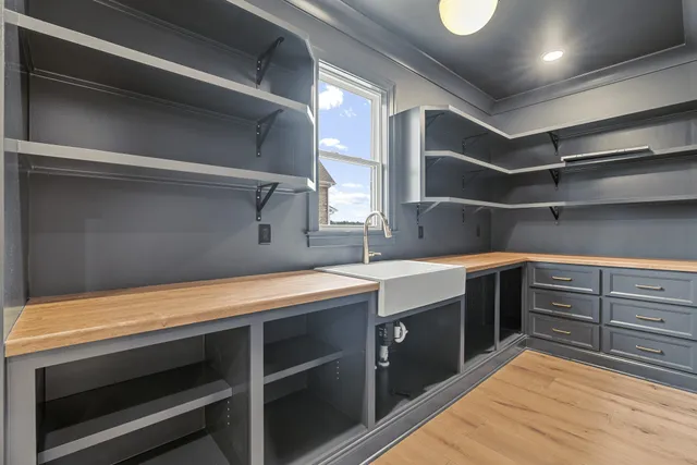 a bathroom with a toilet a sink a mirror and bathtub