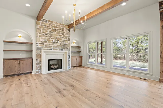 a kitchen with stainless steel appliances granite countertop a stove and a refrigerator
