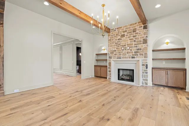 a large kitchen with stainless steel appliances a large counter top