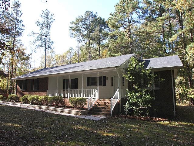 152 Stagecrest Drive Raleigh, NC 27603 - Photo 1 of 14 a front view of house with yard and trees