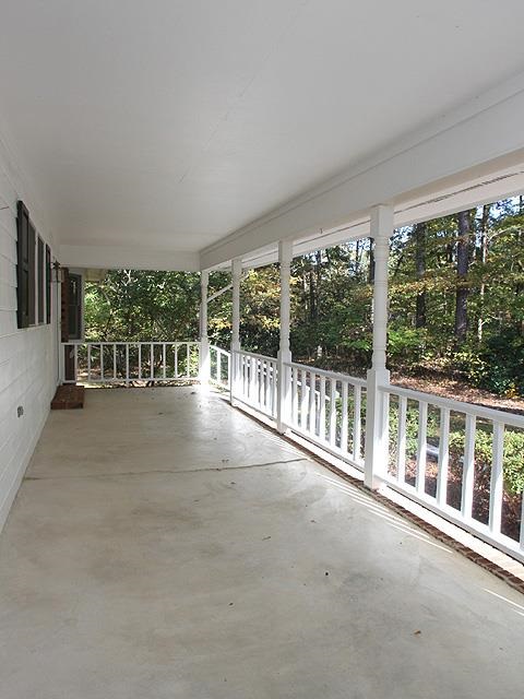 152 Stagecrest Drive Raleigh, NC 27603 - Photo 2 of 14 a view of a porch with wooden floor and outdoor space