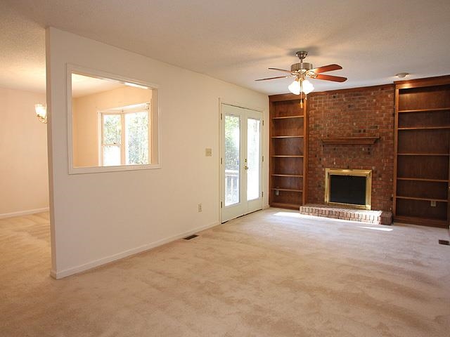 152 Stagecrest Drive Raleigh, NC 27603 - Photo 4 of 14 a view of an empty room with a fireplace and a window