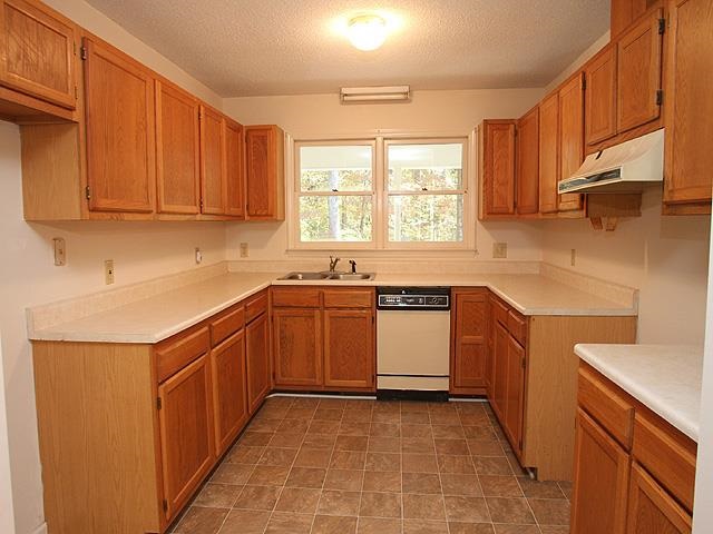 152 Stagecrest Drive Raleigh, NC 27603 - Photo 6 of 14 a kitchen with stainless steel appliances granite countertop a sink stove and cabinets