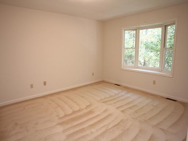 152 Stagecrest Drive Raleigh, NC 27603 - Photo 7 of 14 an empty room with a window