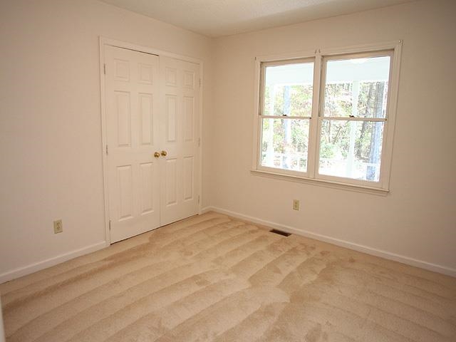 152 Stagecrest Drive Raleigh, NC 27603 - Photo 9 of 14 an empty room with a window