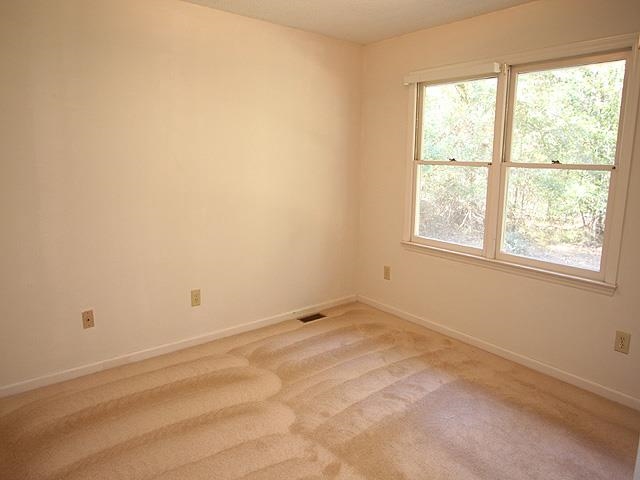 152 Stagecrest Drive Raleigh, NC 27603 - Photo 10 of 14 an empty room with a window