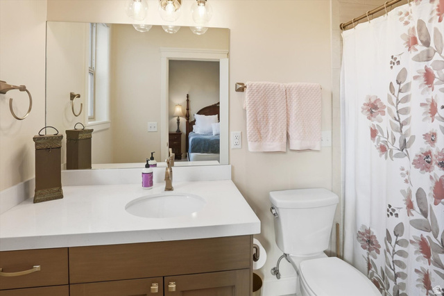 534 East Fish Hatchery Road Mantua, UT 84324 - Photo 37 of 87 Ensuite bathroom featuring curtained shower and vanity