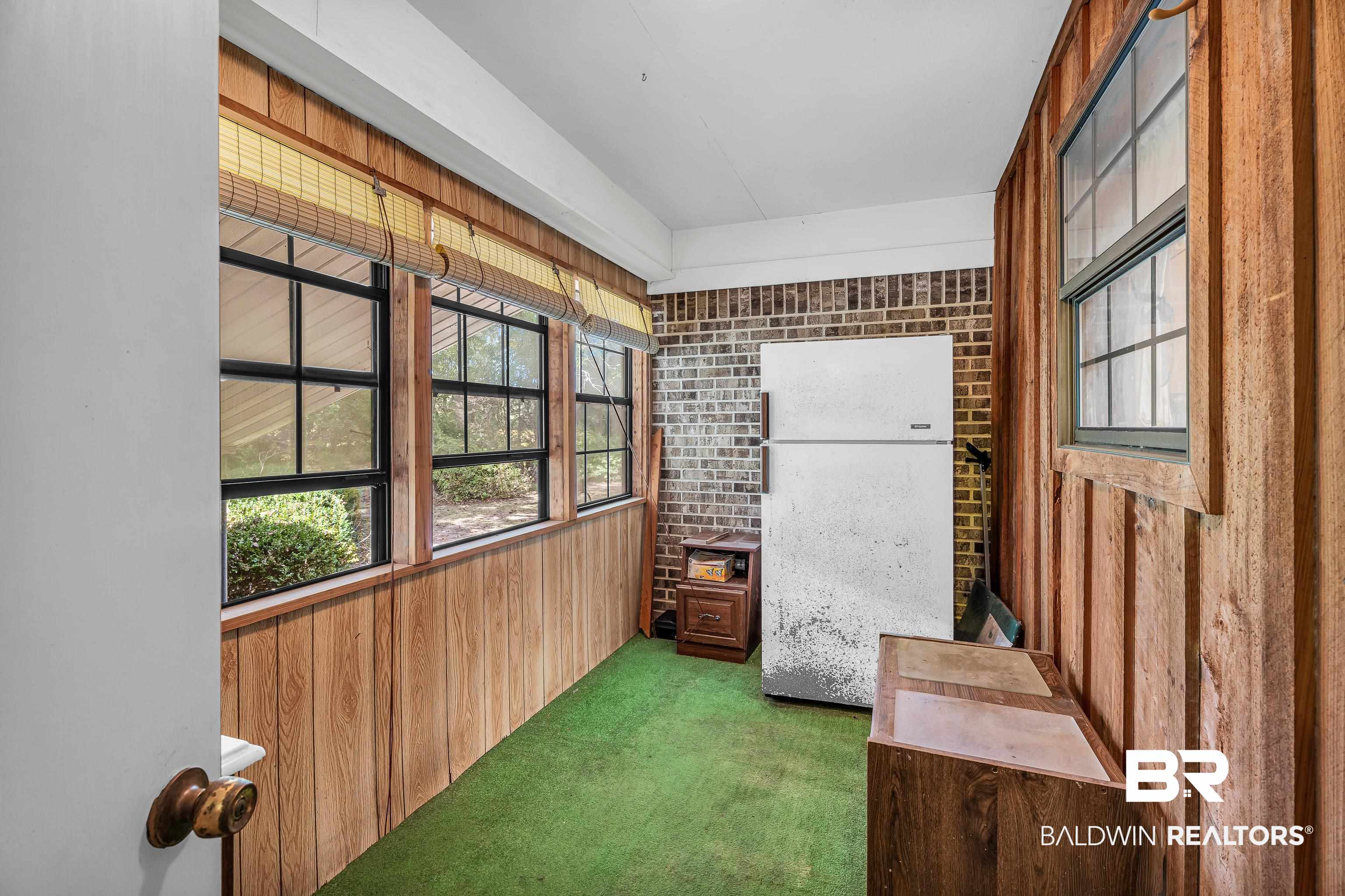 72075 Highway 59 Little River, AL 36550 - Photo 27 of 40 Unfurnished sun porch with healthy amount of natural light