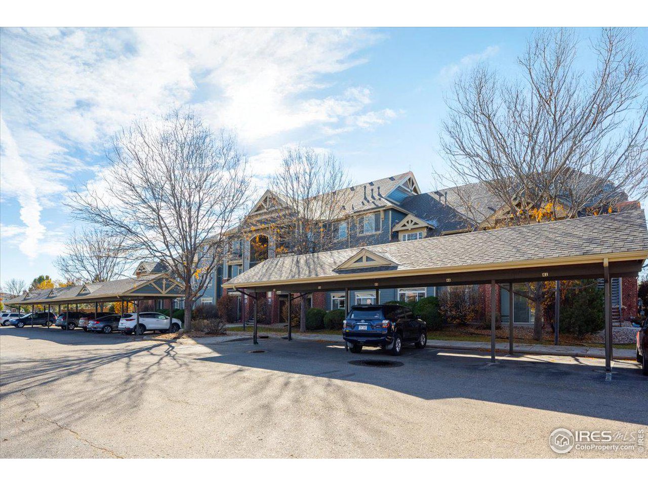 2133 Krisron Road, Unit 101 Fort Collins, CO 80525 - Photo 6 of 22 a view of a town with cars parked