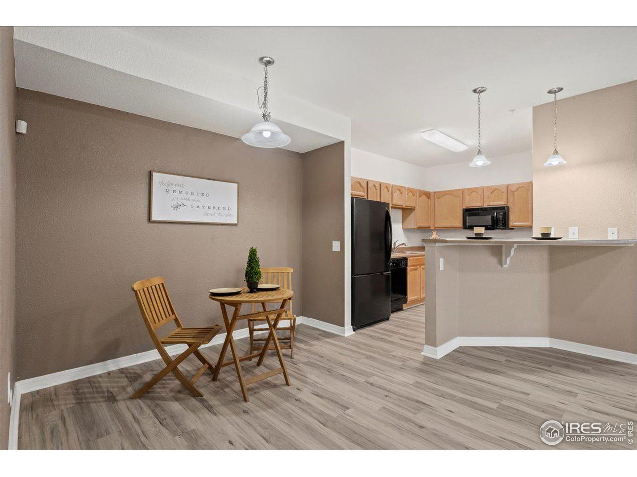 2133 Krisron Road, Unit 101 Fort Collins, CO 80525 - Photo 8 of 22 a view of a dining room with furniture and wooden floor
