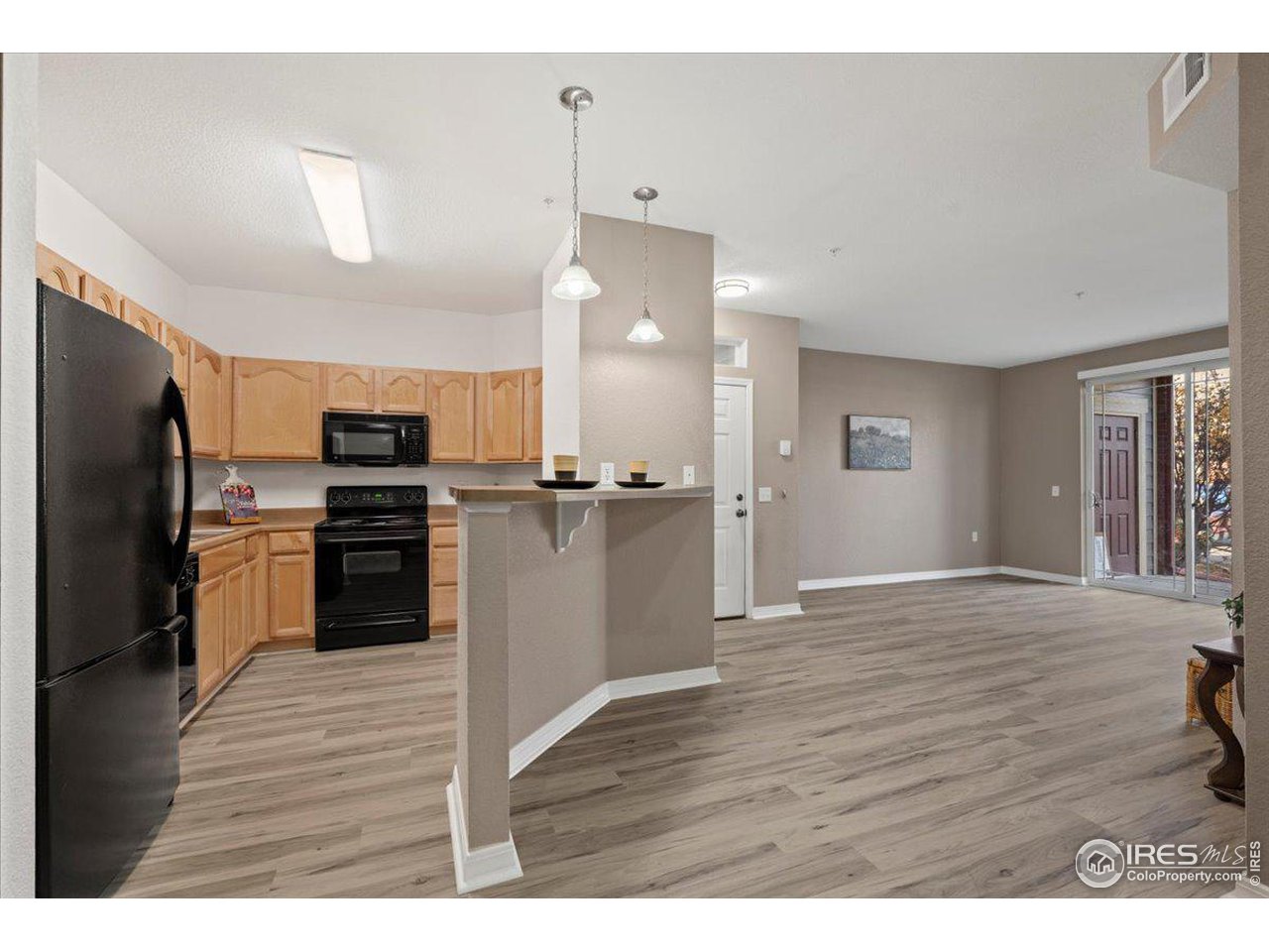 2133 Krisron Road, Unit 101 Fort Collins, CO 80525 - Photo 10 of 22 a view of kitchen with wooden floor