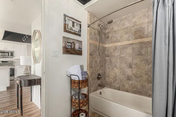 a bathroom with a bathtub and a shower