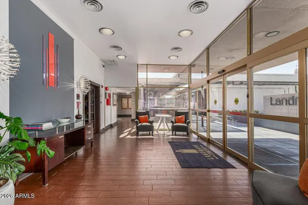 a living room with lots of furniture and a rug