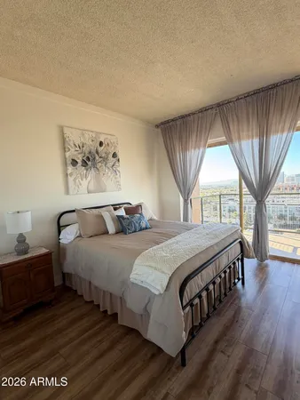 a bedroom with double bed and a window