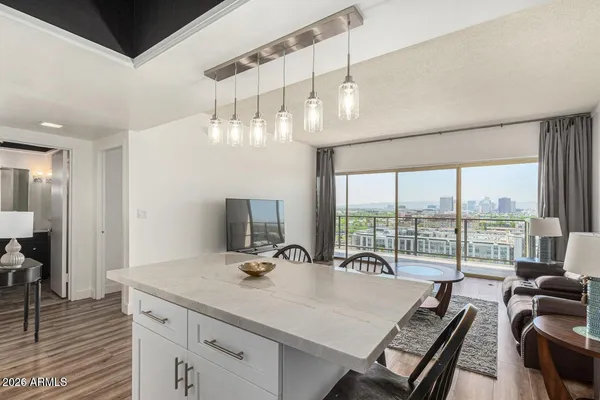 a view of a livingroom with furniture window and wooden floor