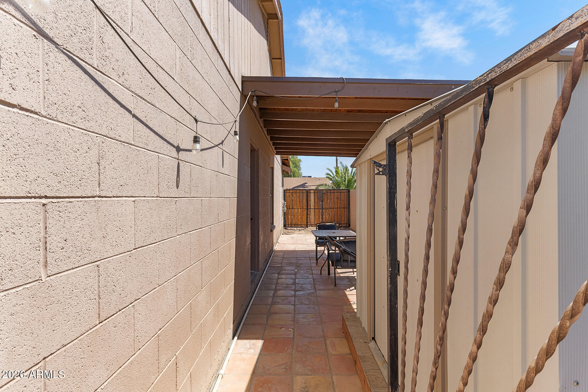 9002 West Coronado Road Phoenix, AZ 85037 - Photo 44 of 54 a backyard of a house with table and chairs
