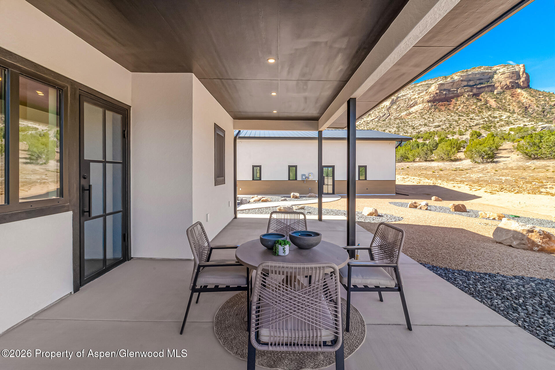 2216 Rimrock Road Grand Junction, CO 81507 - Photo 13 of 84 a view of a dining room with furniture window and outside view
