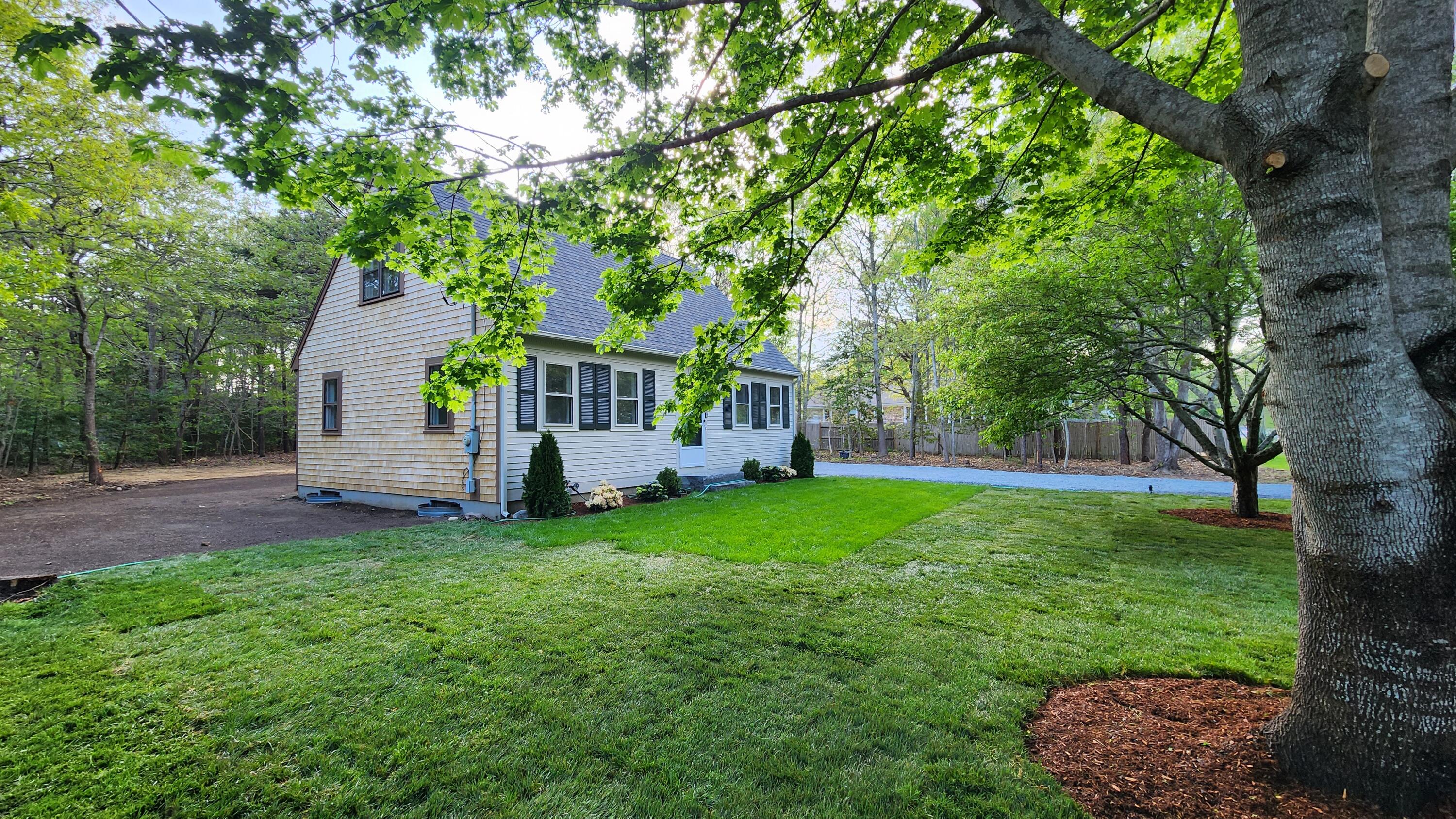 147 Chippingstone Road Marstons Mills, MA 02648 - Photo 17 of 23 a view of a house with a yard and tree