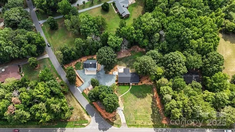 an aerial view of house with yard