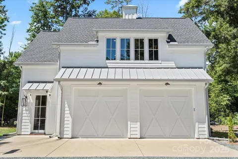 a view of a white house with a large windows