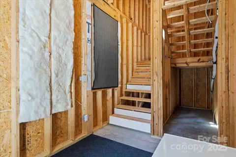 a view of front door with wooden floor