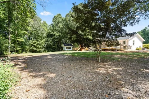 a view of outdoor space with trees all around