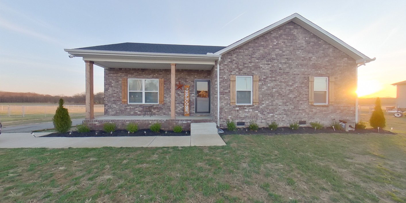 front view of a house with a yard