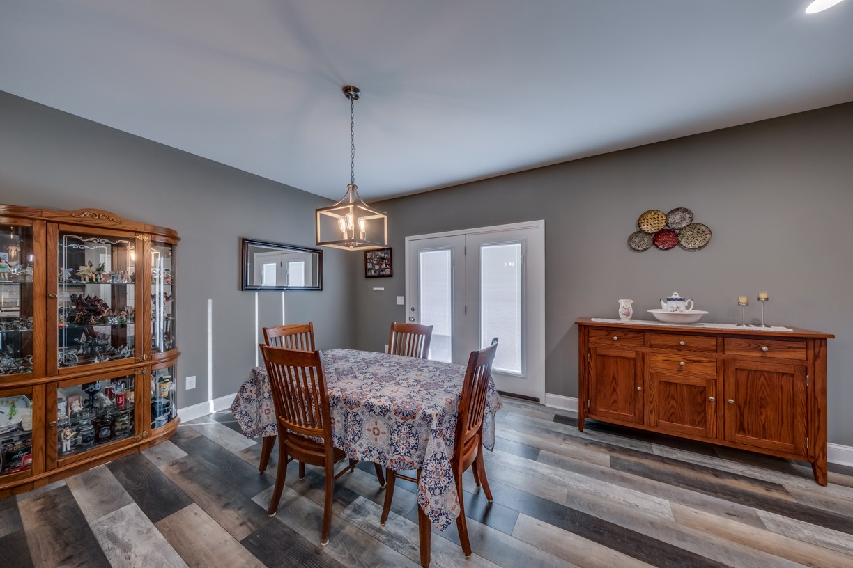 148 A T G T Road Portland, TN 37148 - Photo 11 of 30 a view of a dining room with furniture window and wooden floor